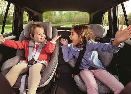 two kids in car enjoying toddler car trip activities